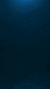 a glowing circle in the middle of a blue background
