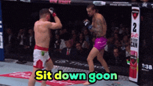 two men are fighting in a boxing ring with the words sit down goon on the bottom