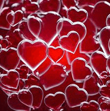 a bunch of red hearts floating in the air on a red background