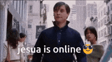 a man in a blue shirt is walking down a city street with the words " jesus is online " on the bottom