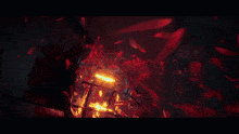 a dark room with red flames coming out of a cage