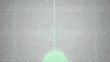 a green light is coming out of a hole in the ground .