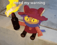a stuffed animal holding a torch with the words heed my warning on it