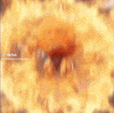 a close up of a person 's face with a blurred background and a flame coming out of it .