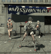 a group of people standing in front of a mission acc sign