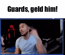 a man is sitting in front of a computer screen with the words guards , geld him !