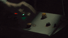 a person 's hand is pressing a button on a control panel that says ' warning ' on it