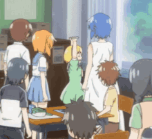 a group of children are gathered in a classroom with a girl raising her hand in the air