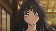 a close up of a girl with long black hair