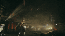 a man playing a guitar on a stage with the letter d on the bottom