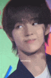 a close up of a person 's face with the name istobecely on the bottom right corner