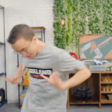 a man in a kirkland t-shirt is dancing
