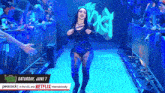 a woman in a black outfit is walking down a blue aisle with the words saturday june 7 on it