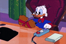 a cartoon of donald duck sitting at a desk with his feet tied