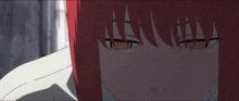 a close up of a girl 's face with red hair and yellow eyes