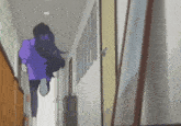 a person is running down a hallway with a red fire extinguisher on the wall