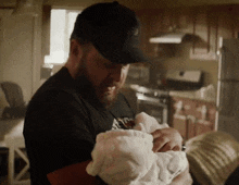 Holding A Baby Seal Team GIF - Holding A Baby Seal Team Sonny Quinn GIFs