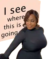 a woman is standing in front of a sign that says i see where this is going