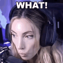 a woman wearing headphones is making a funny face with the words what written above her
