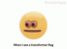 a person is holding a gun in front of a yellow smiley face that says " when i see a transformer flag "