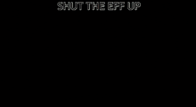 a picture of a fighter jet with the words shut the eff up below it