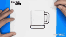 a person is holding a piece of paper with a drawing of a coffee mug on it