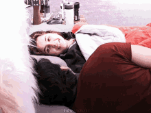 a man and a woman are laying on a bed with the words sidnaazbliss written on the bottom