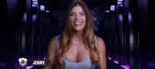a woman in a blue tank top is smiling in front of a purple background with the name jenny on it .