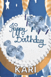 a birthday cake with blue frosting and candles that says happy birthday kari