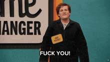 a man with a name tag that says very politely says fuck you