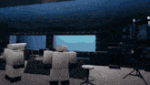 a room with a stool and a monitor that says ' i 'm sorry ' on it