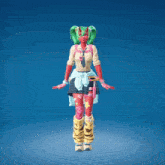 a girl with a red face and green hair is jumping in the air with her arms in the air