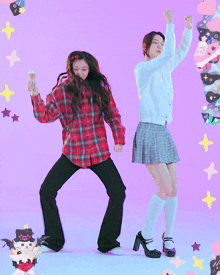 a girl in a plaid shirt and a girl in a plaid skirt are dancing together