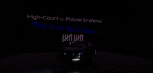 a car is parked in front of a sign that says high court u. polizei erzfeind