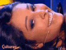 a close up of a woman 's face with the words culturashow written on the bottom