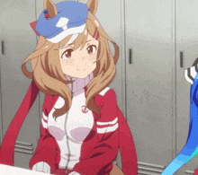 a girl wearing a blue hat and a red jacket has the letter t on her chest