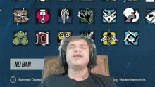 a man wearing headphones is sitting in front of a screen that says ' no ban '