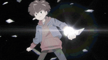 a boy in a hoodie is holding a knife in a dark room