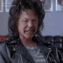 a man wearing a leather jacket and a white shirt is made with reface app
