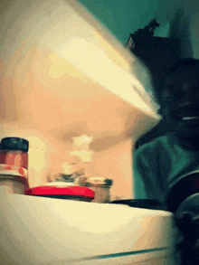 a blurred image of a person opening a refrigerator