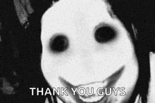 a black and white photo of a person with a smiley face on their face .