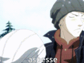 a man wearing a beanie and a scarf is standing in the snow and the word aspesse is on the bottom right