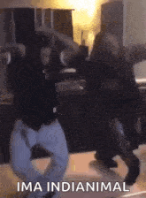 a group of people are dancing in a kitchen with the words ima indianimal written on the bottom