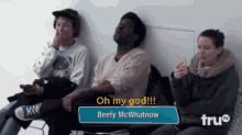 a group of people are sitting in a waiting room and one of them says oh my god