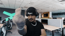a man wearing headphones and a beanie with the word hype written on it