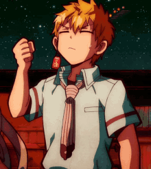 a boy in a white shirt and tie is holding a bottle with a red label that says ' ys ' on it