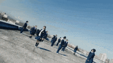 a group of people standing on top of a roof