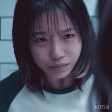 a close up of a woman 's face with netflix on the bottom right