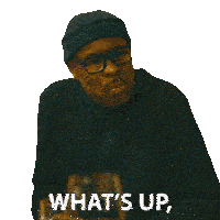 a man wearing glasses and a beanie is asking if he 's in trouble
