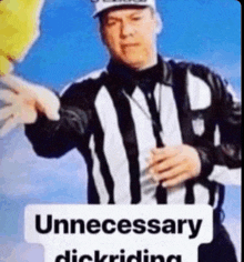 a referee is holding up a sign that says unnecessary dickriding